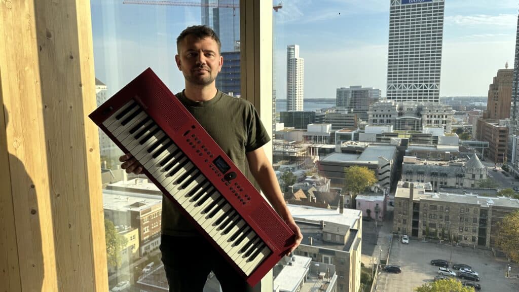 me holding me roland go keys 3 in a window